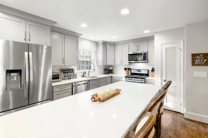 White Shaker Cabinets with Butcherblock Countertops – Warm, Classic & Functional